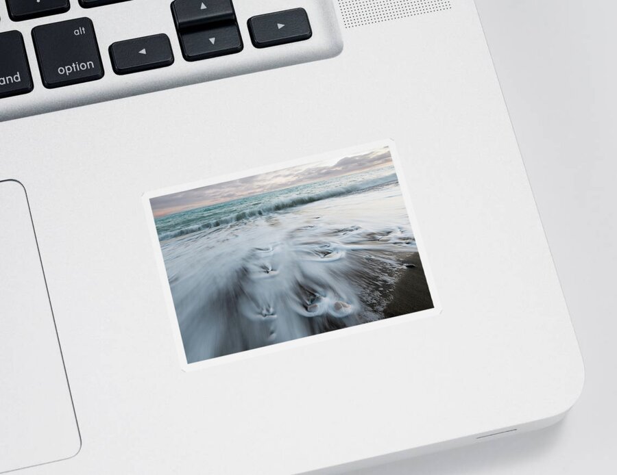 Coastline Sticker featuring the photograph Pebbles in the beach and flowing sea water by Michalakis Ppalis