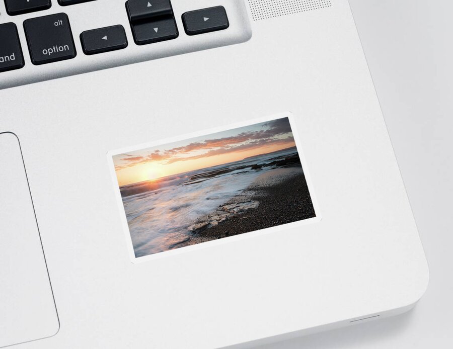 Seascape Sticker featuring the photograph Beautiful dramatic Sunset over a rocky coast by Michalakis Ppalis