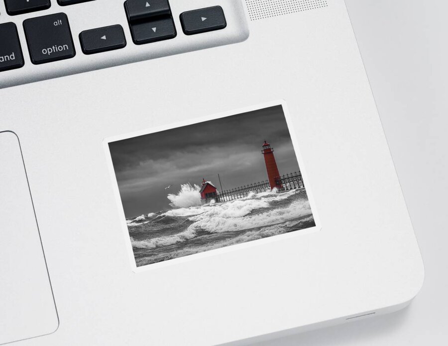 Lighthouse Sticker featuring the photograph November Storm with Flying Gull by the Grand Haven Lighthouse by Randall Nyhof