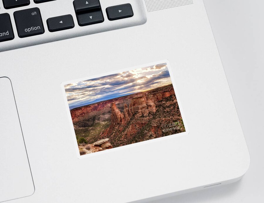 Colorado National Monument Sticker featuring the photograph The Sun coming up over the Colorado National Monument by Ronda Kimbrow
