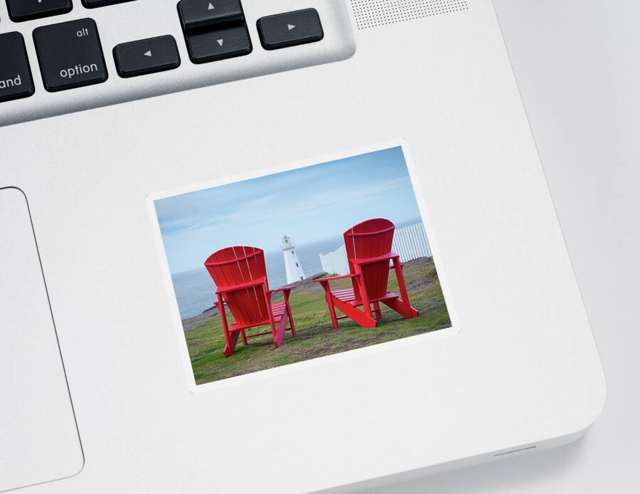 Adirondack Chairs Sticker featuring the photograph Two Red Adirondack Chairs looking out to a Lighthouse by Art Whitton