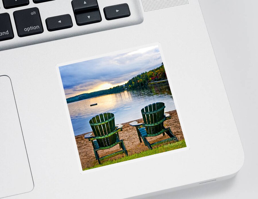 Lake Sticker featuring the photograph Wooden chairs at sunset on beach 1 by Elena Elisseeva