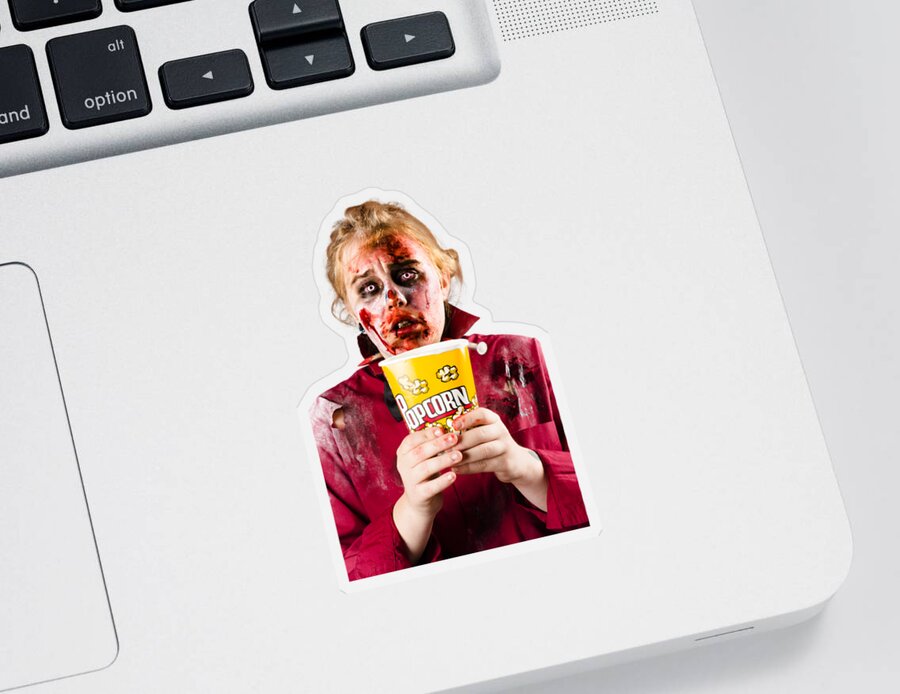 Scary Sticker featuring the photograph Zombie woman watching scary movie with popcorn by Jorgo Photography