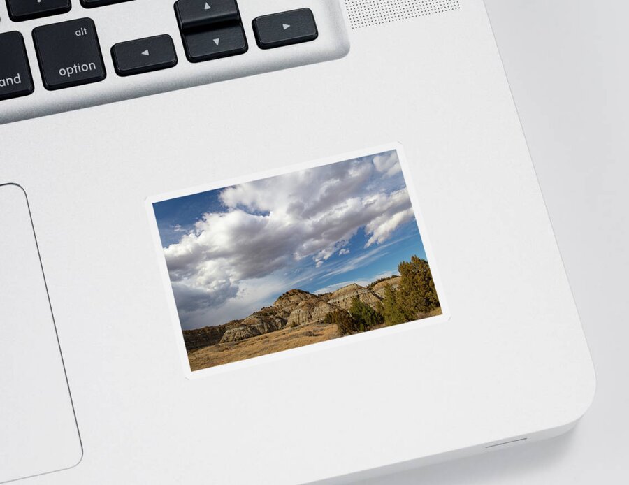 Buffalo Sticker featuring the photograph Clouds over mountains at Theodore Roosevelt National Park in North Dakota by Eldon McGraw