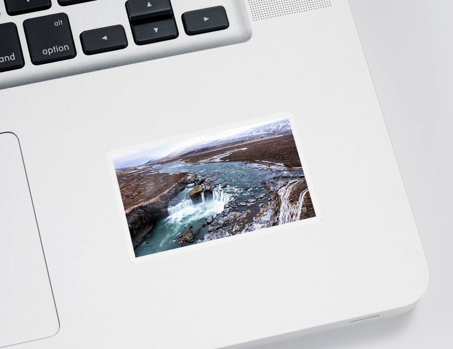 Waterfall Sticker featuring the photograph Drone shot of Godafoss waterfall, Iceland, taken from a high angle. Aerial view of the powerful cascade, river and snow covered rocks. by Jane Rix