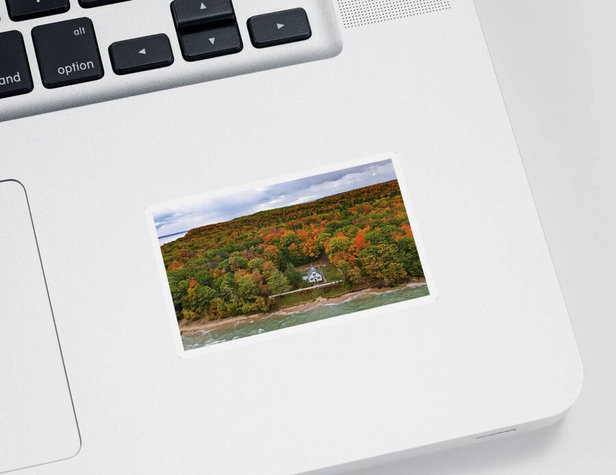 Lighthouse Sticker featuring the photograph Mission Point Lighthouse with fall colors in Traverse City Michigan by Eldon McGraw
