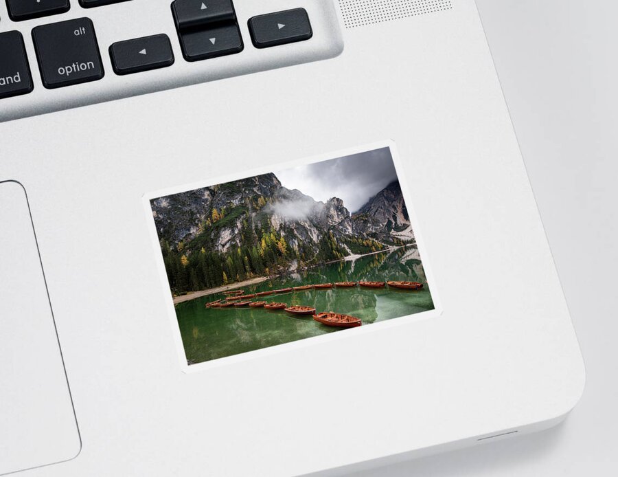 Lago Di Braies Sticker featuring the photograph Wooden boats on the peaceful lake. Lago di braies, Italy by Michalakis Ppalis
