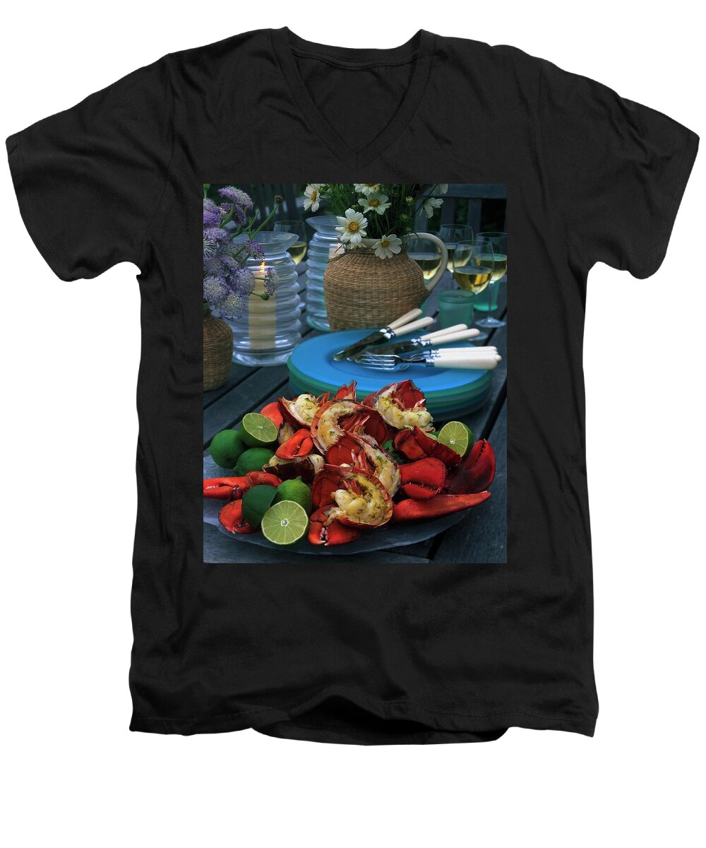 Still Life Men's V-Neck T-Shirt featuring the photograph A Meal With Lobster And Limes by Romulo Yanes