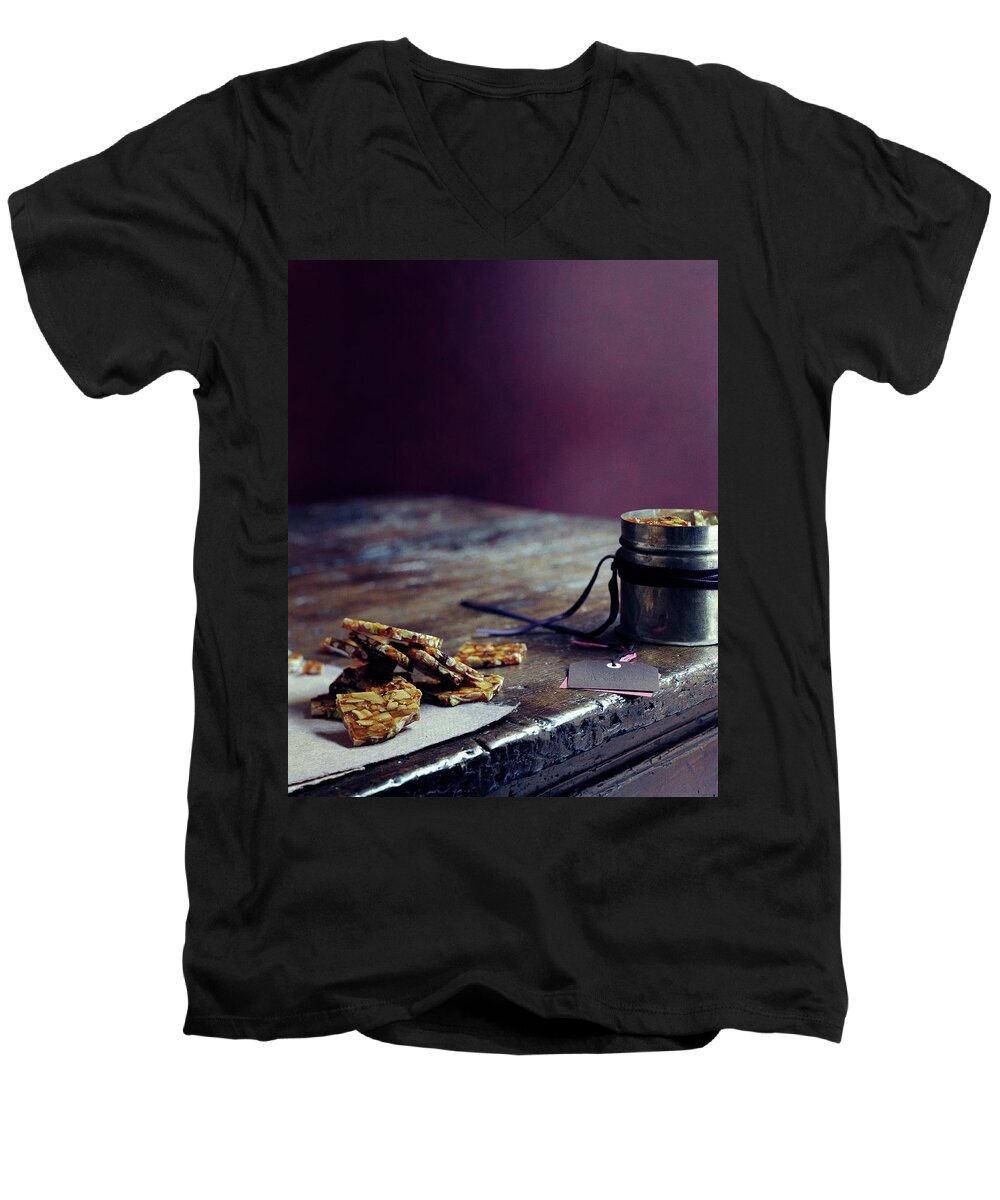 Cooking Men's V-Neck T-Shirt featuring the photograph Indian Brittle by Romulo Yanes