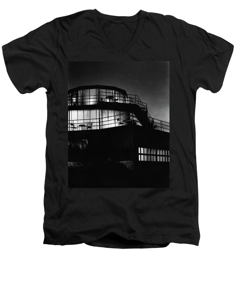 Home Men's V-Neck T-Shirt featuring the photograph The Exterior Of A Spiral House Design At Night by Eugene Hutchinson