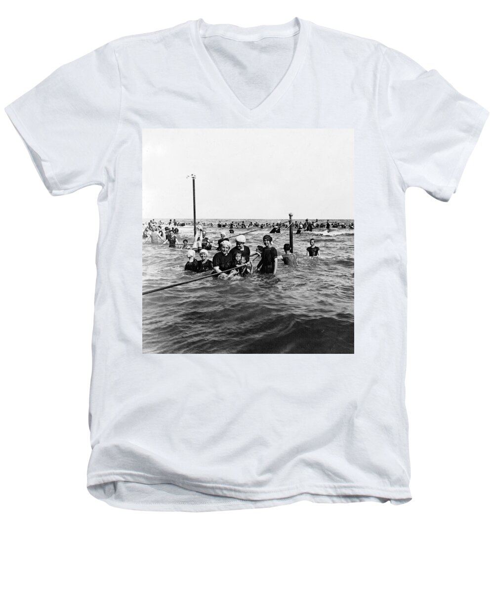 Galveston Men's V-Neck T-Shirt featuring the photograph Bathing in the Gulf of Mexico - Galveston Texas c 1914 by International Images