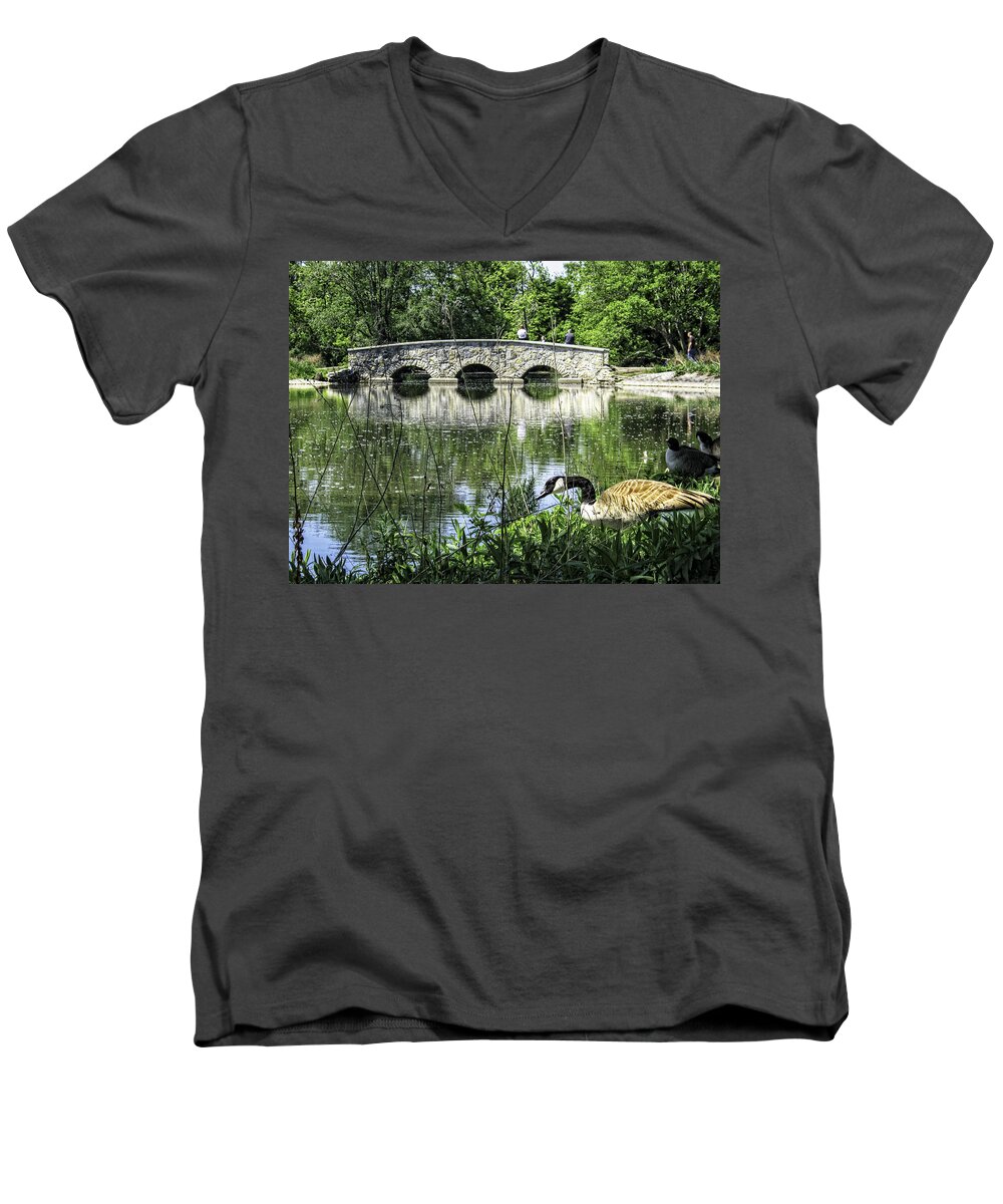 Goose Wildlife Bridge Lake Water Rochester Minnesota Silver Grass Trees Nature Landscape Bird Animal Men's V-Neck T-Shirt featuring the photograph Goose and Bridge at Silver Lake by Tom Gort