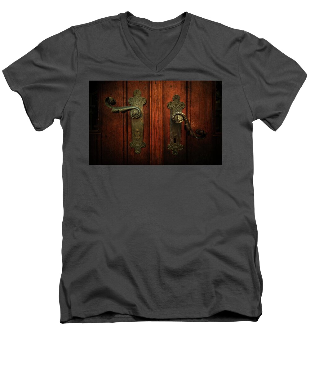 Gate Men's V-Neck T-Shirt featuring the photograph Closeup of two ornamented handles by Jaroslaw Blaminsky