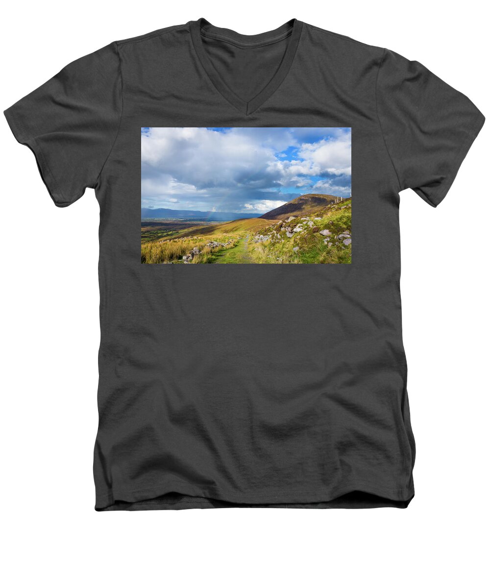Blue Men's V-Neck T-Shirt featuring the photograph Raining down and sunshine with rainbow on the countryside in Ire by Semmick Photo