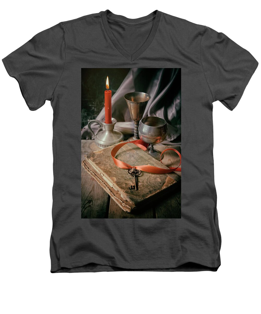 Lit Men's V-Neck T-Shirt featuring the photograph Still life with old book and metal dishes by Jaroslaw Blaminsky