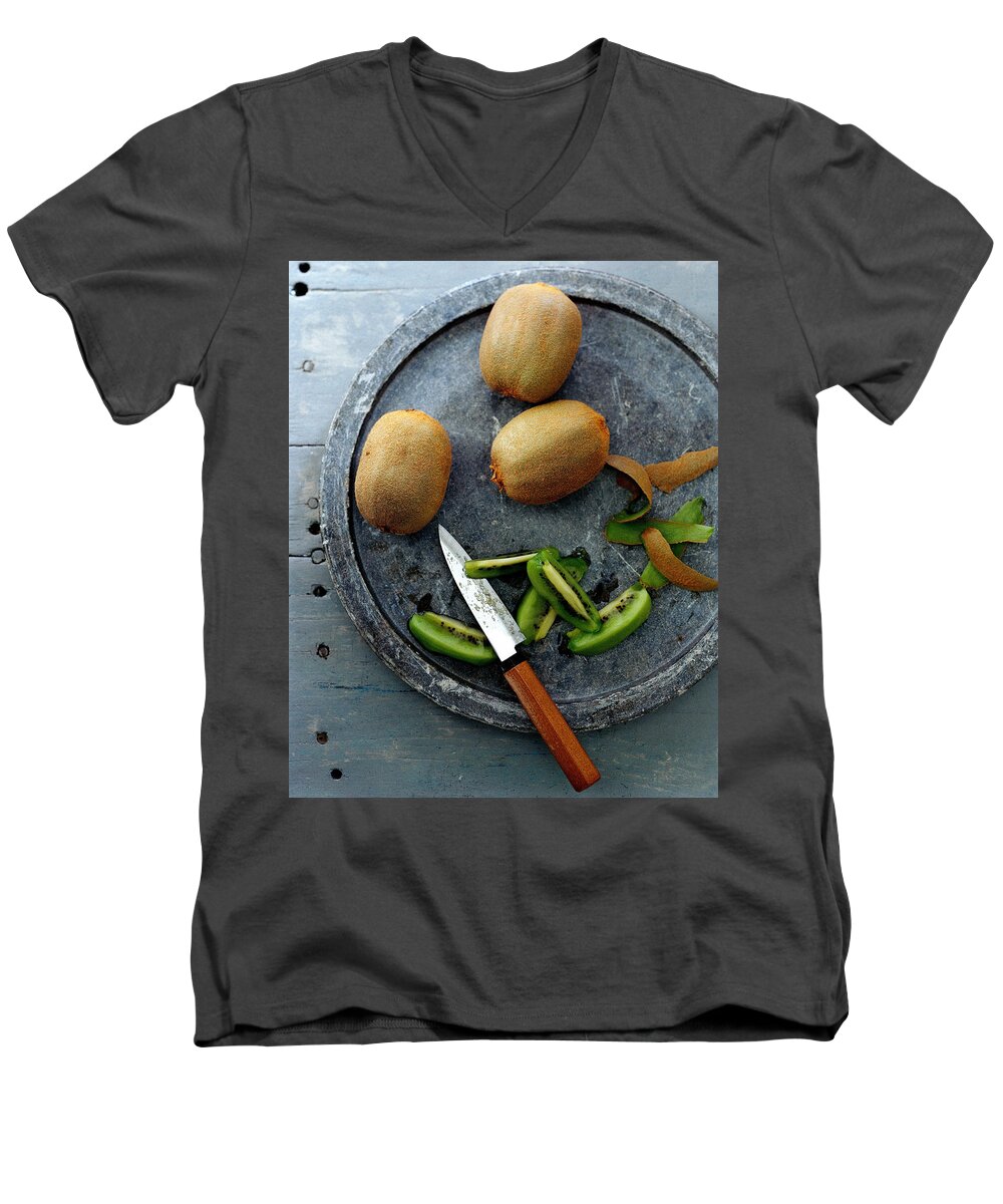 Foodstudio Shotstill Lifeplatetablewareknifekiwi Fruitfruithealthy Eatingsliceview From Above #condenastgourmetphotograph November 1st 2006 Men's V-Neck T-Shirt featuring the photograph A Plate Of Kiwifuit by Romulo Yanes