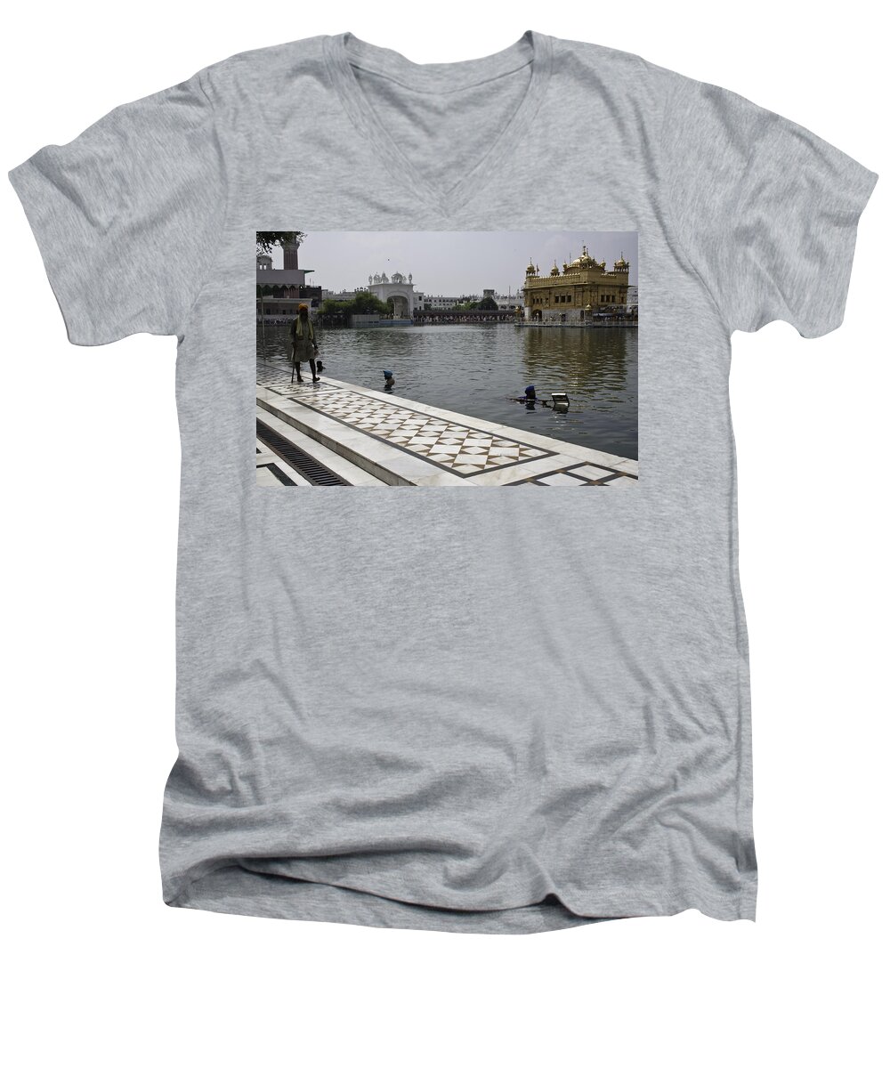  Men's V-Neck T-Shirt featuring the photograph Clearing the sarovar inside the Golden temple resorvoir by Ashish Agarwal