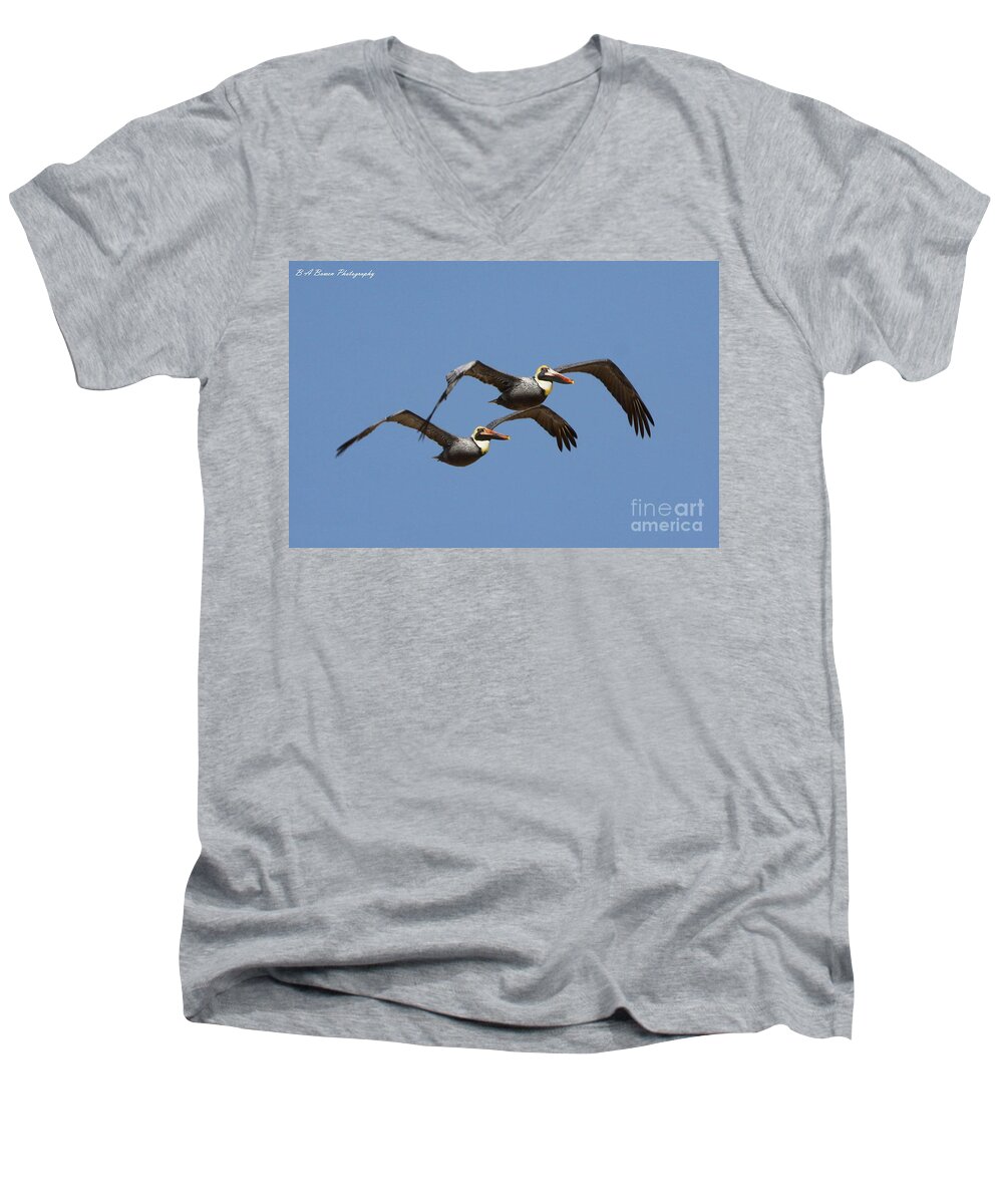 Brown Pelican Men's V-Neck T-Shirt featuring the photograph Duel Pelicans in flight by Barbara Bowen