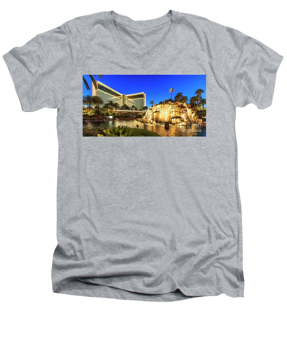 The Mirage Men's V-Neck T-Shirt featuring the photograph The Mirage Casino and Volcano at Dusk by Aloha Art