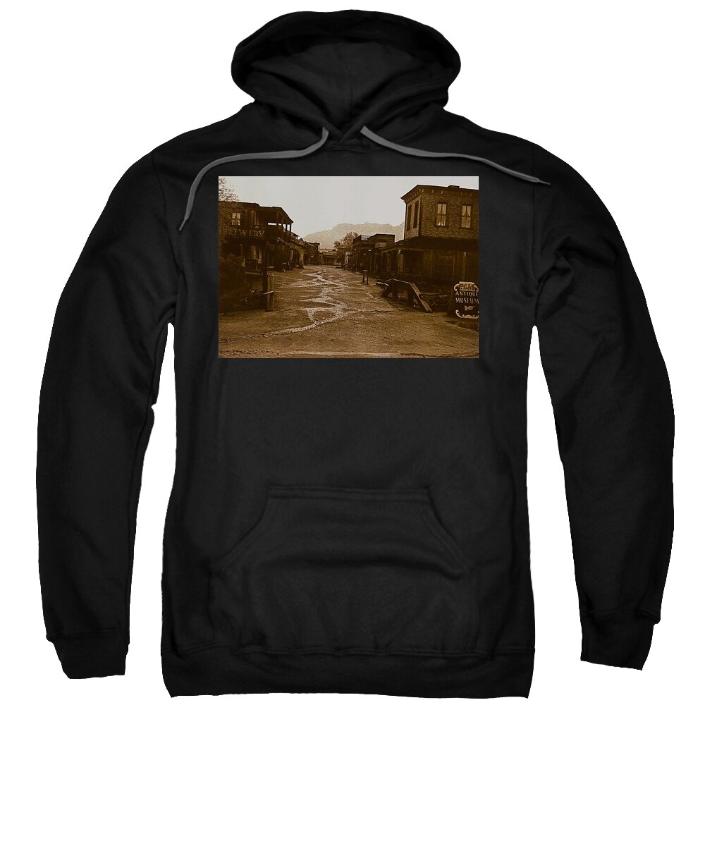 Sheriff's Office Rio Bravo Old Tucson Rain Sepia Toned Sweatshirt featuring the photograph Old Tucson set in the rain 1967 by David Lee Guss