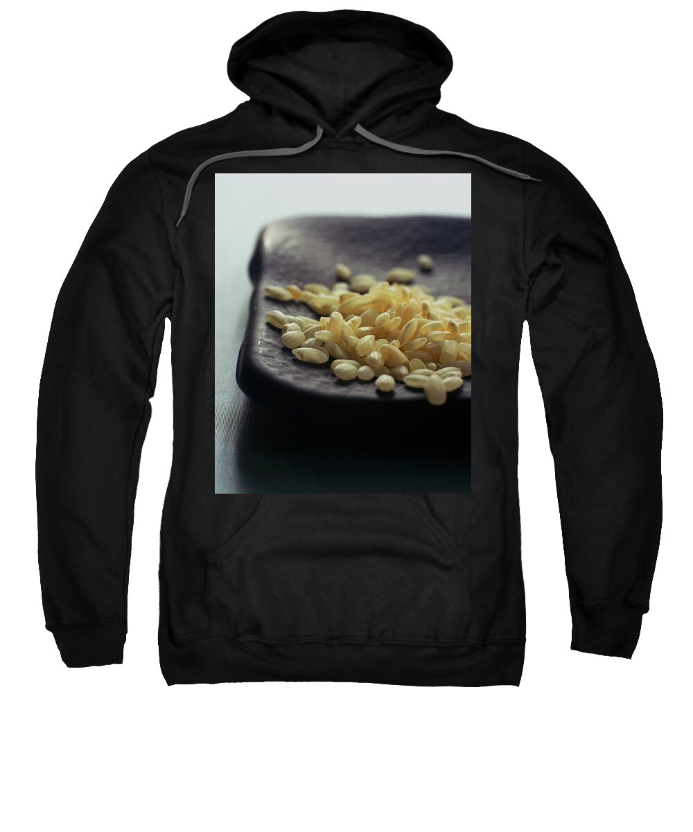 Grains Sweatshirt featuring the photograph Rice On A Black Plate by Romulo Yanes
