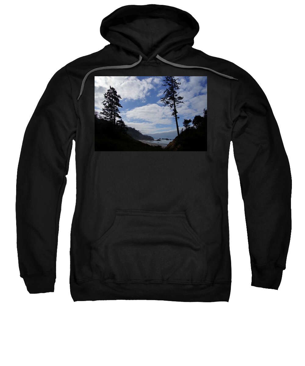 Beach Sweatshirt featuring the photograph Silhouette of large conifers on coastal headland #4 by Steve Estvanik