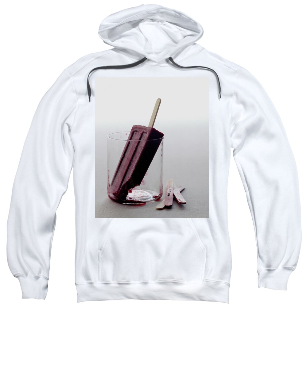 Snack Sweatshirt featuring the photograph A Blueberry Lime Popsicle by Romulo Yanes