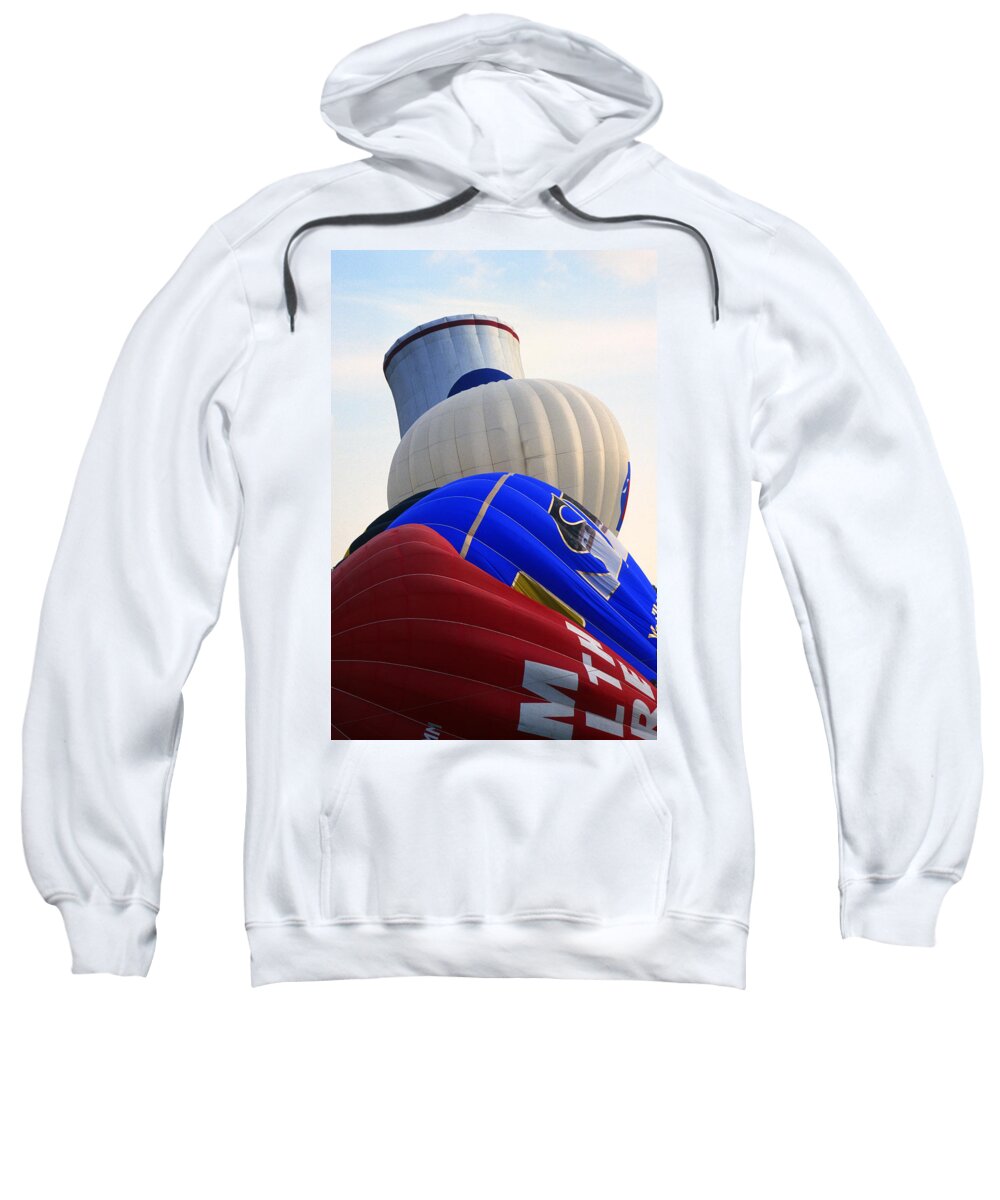 Balloons Sweatshirt featuring the photograph A Row of Balloons being Inflated by Gordon James