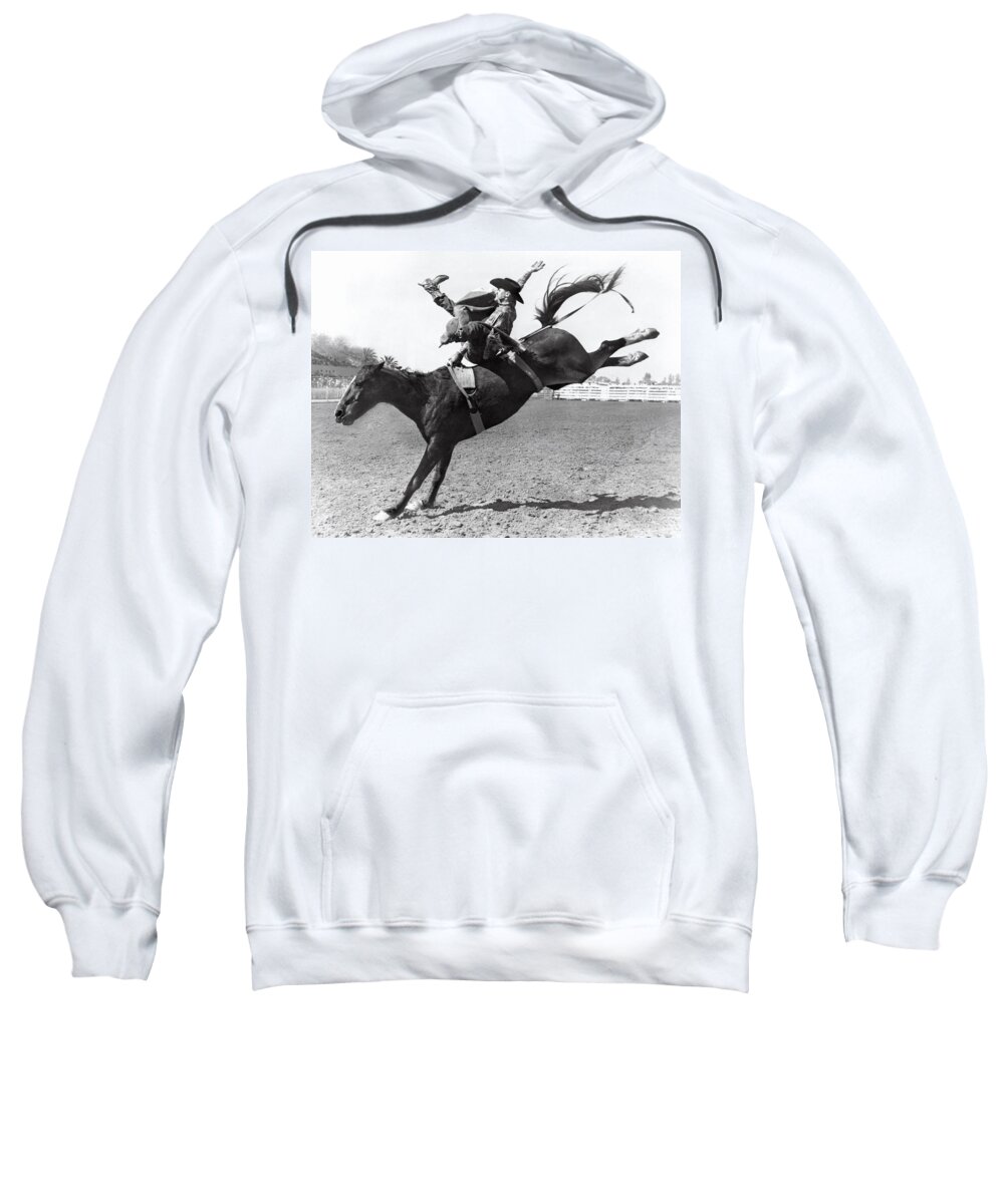1950 Sweatshirt featuring the photograph Riding A Bucking Bronco by Underwood Archives