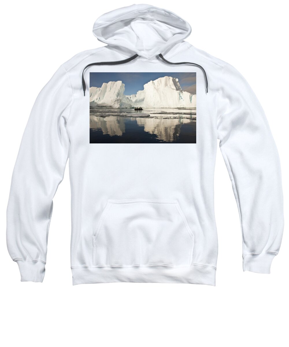 00427982 Sweatshirt featuring the photograph Tourists In Zodiac Looking At Iceberg by Colin Monteath