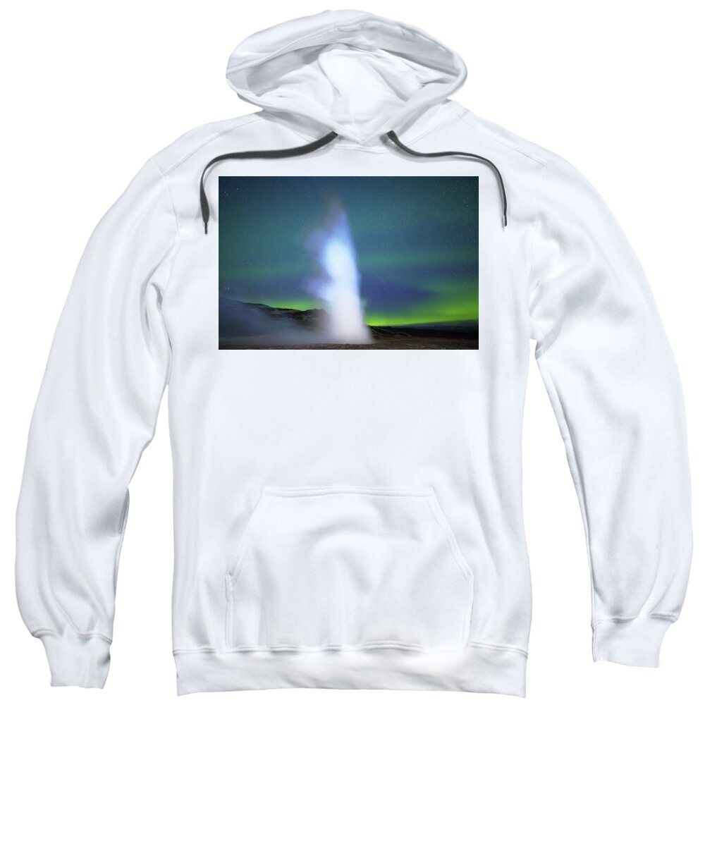 Iceland Sweatshirt featuring the photograph Geyser and aurora by Christopher Mathews