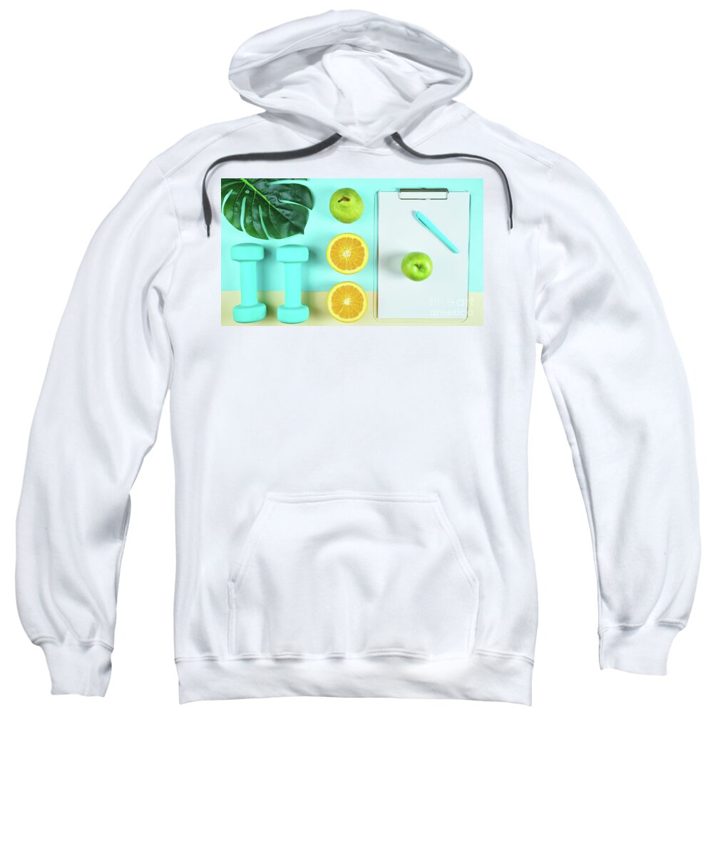 Health Sweatshirt featuring the photograph Health and fitness concept on modern colorful background. by Milleflore Images