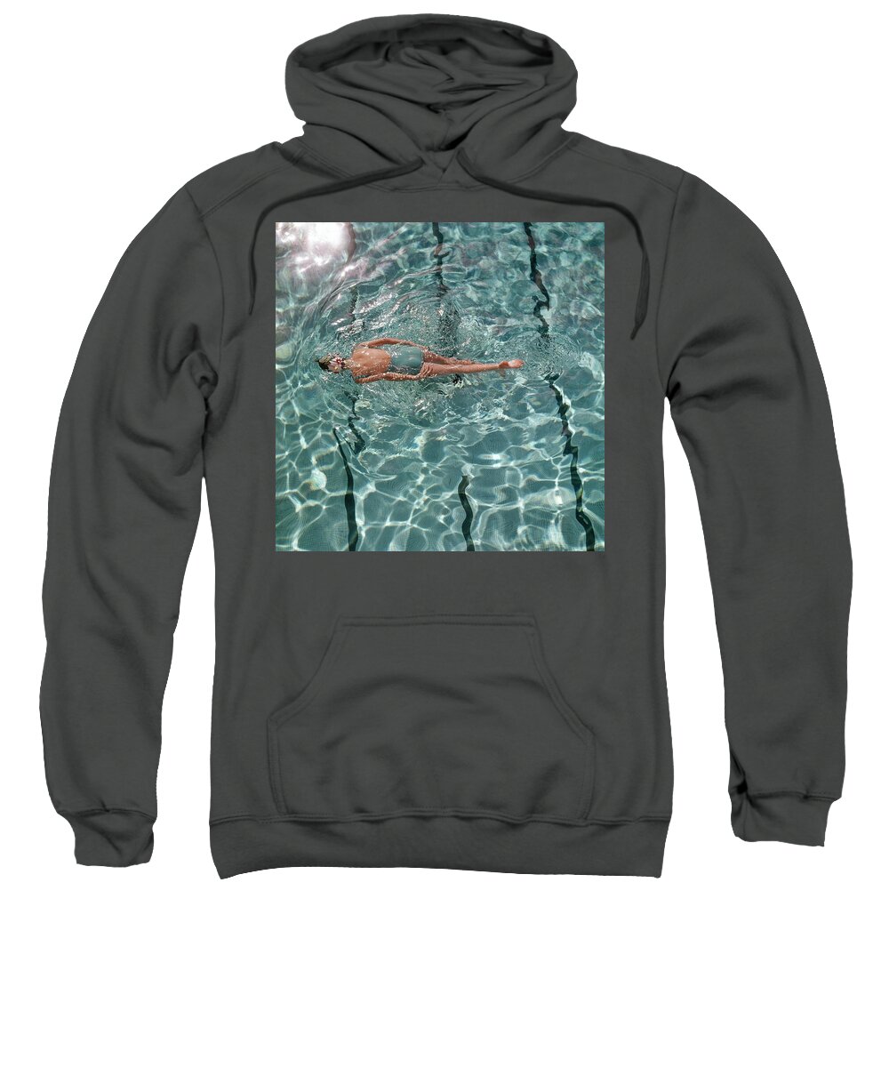 Water Sweatshirt featuring the photograph A Woman Swimming In A Pool by Fred Lyon