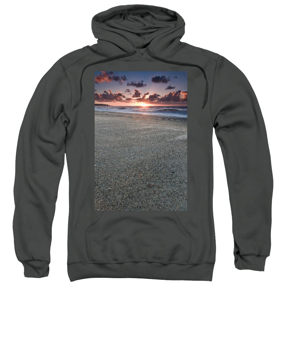 Beach Sweatshirt featuring the photograph A beach during sunset with glowing sky by U Schade