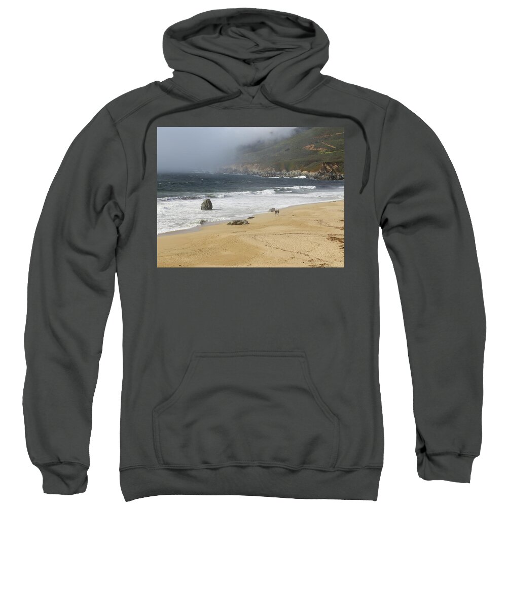 Holiday Sweatshirt featuring the photograph Couple walking on a beach by Alberto Zanoni