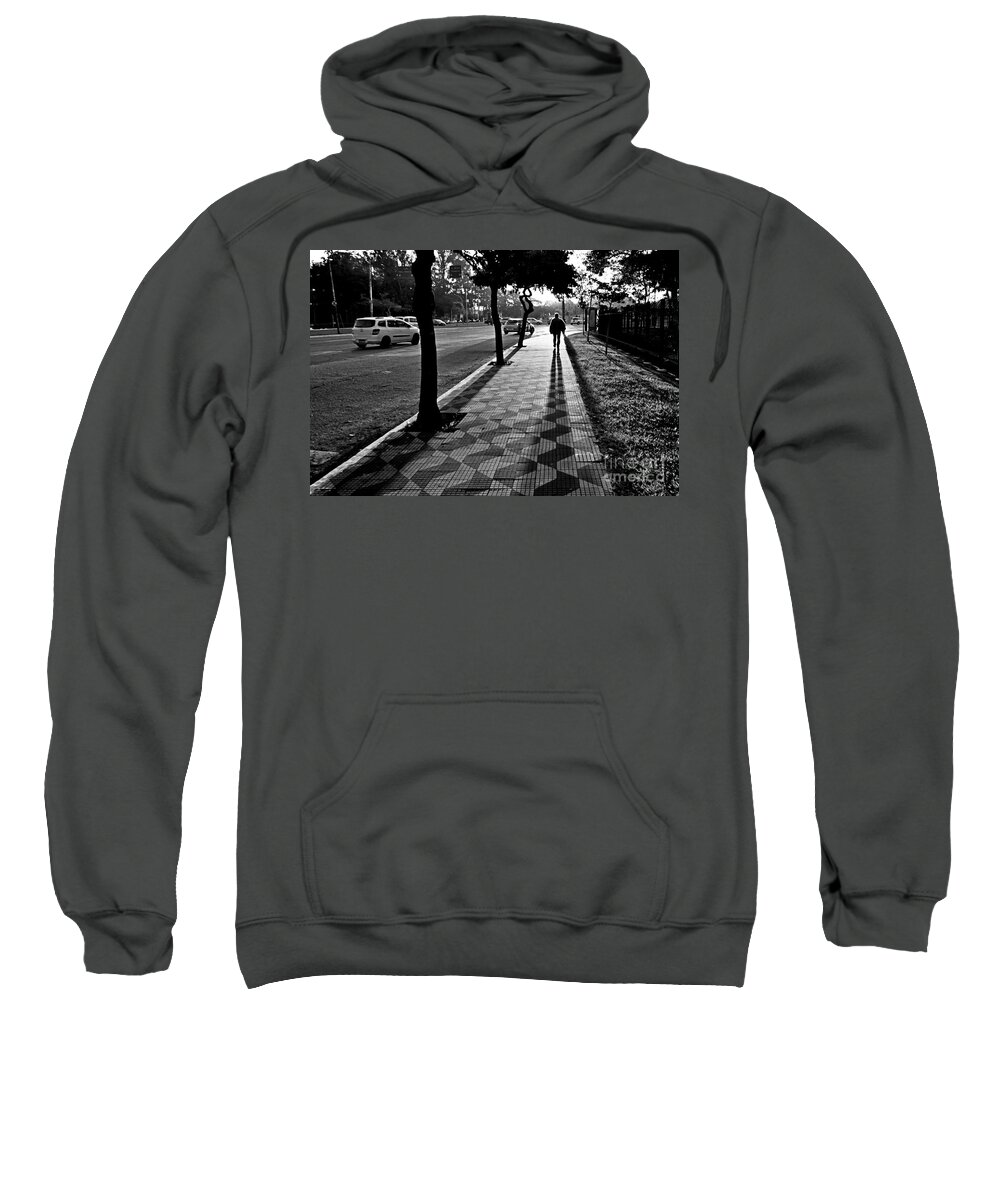 Sidewalk Sweatshirt featuring the photograph Lonely Man Walking at Dusk in Sao Paulo by Carlos Alkmin