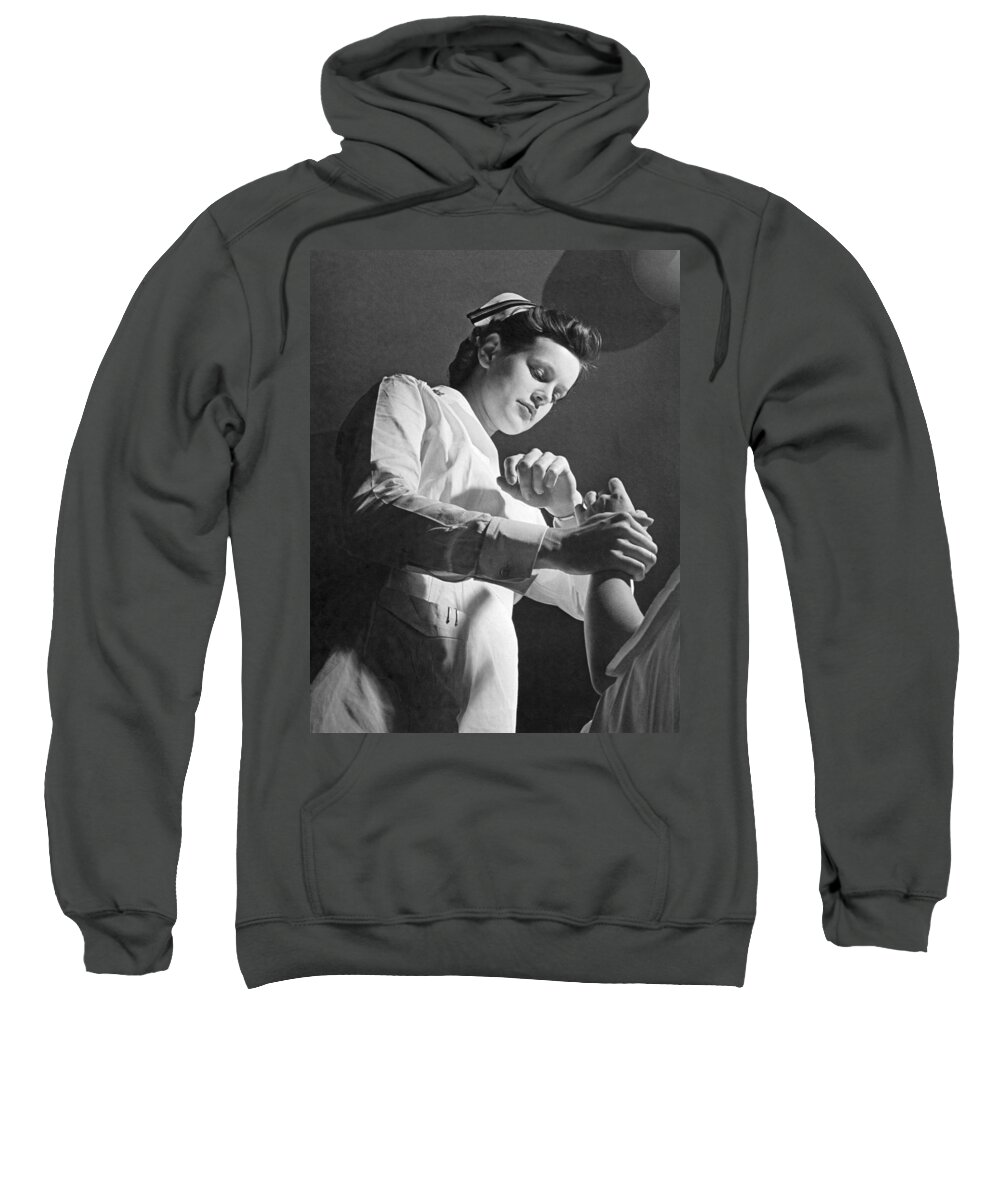 1940s Sweatshirt featuring the photograph US Navy Nurse Taking A Pulse by Underwood Archives