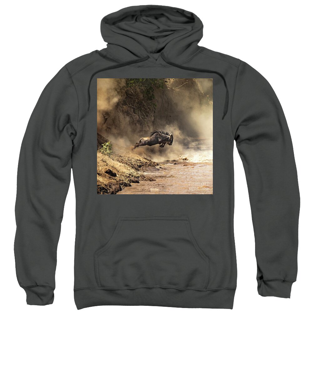 Mara Sweatshirt featuring the photograph Wildebeest leaps from the bank of the Mara river by Jane Rix