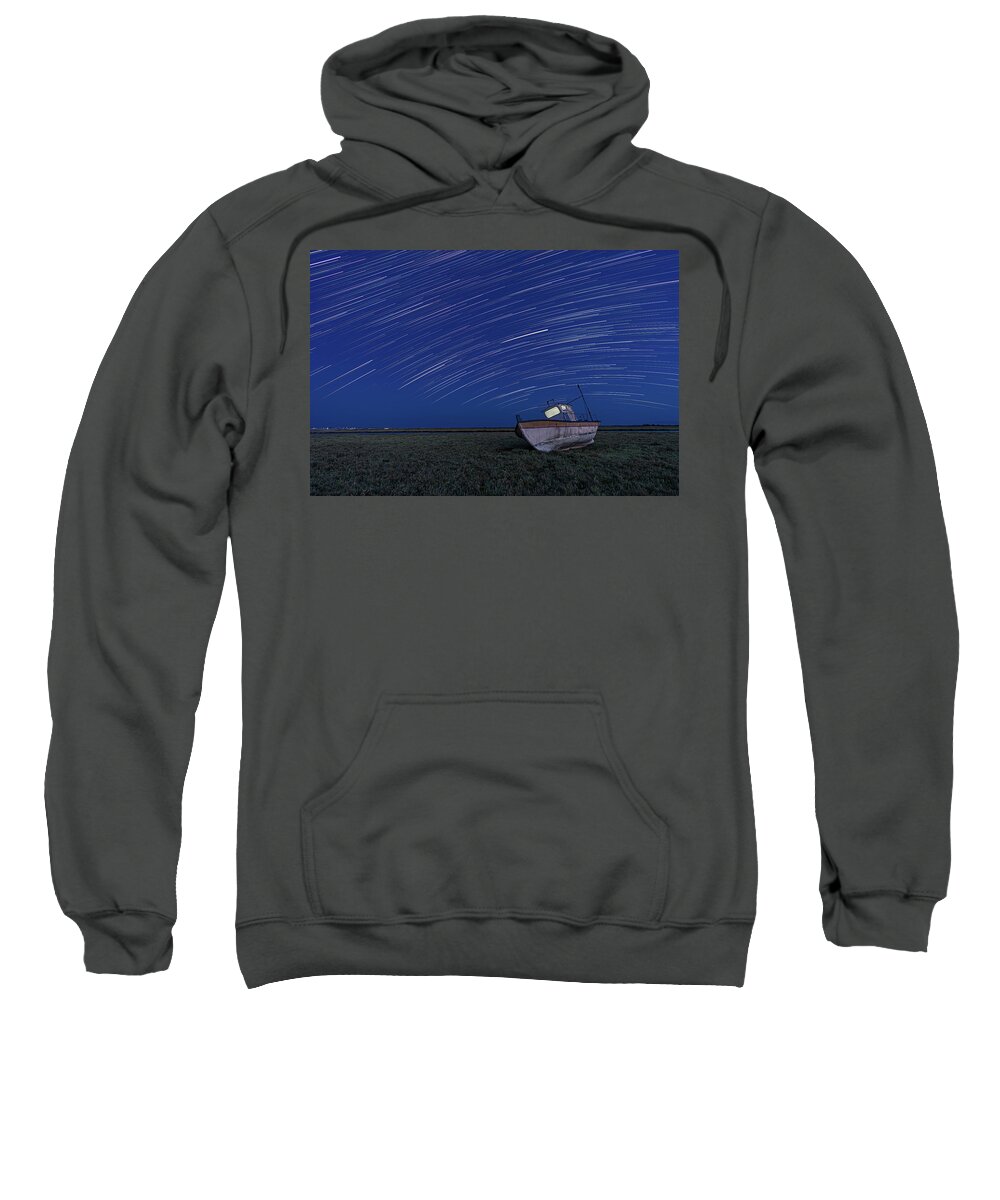 Stars Sweatshirt featuring the photograph Star Trails over an old boat by Alexios Ntounas