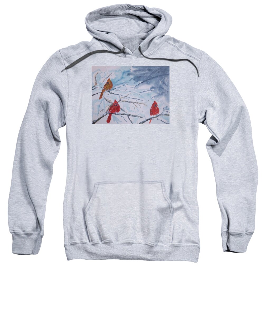 Cardinals Sweatshirt featuring the painting A trio of Cardinals Nestled in Snow Covered Branches by Ellen Levinson
