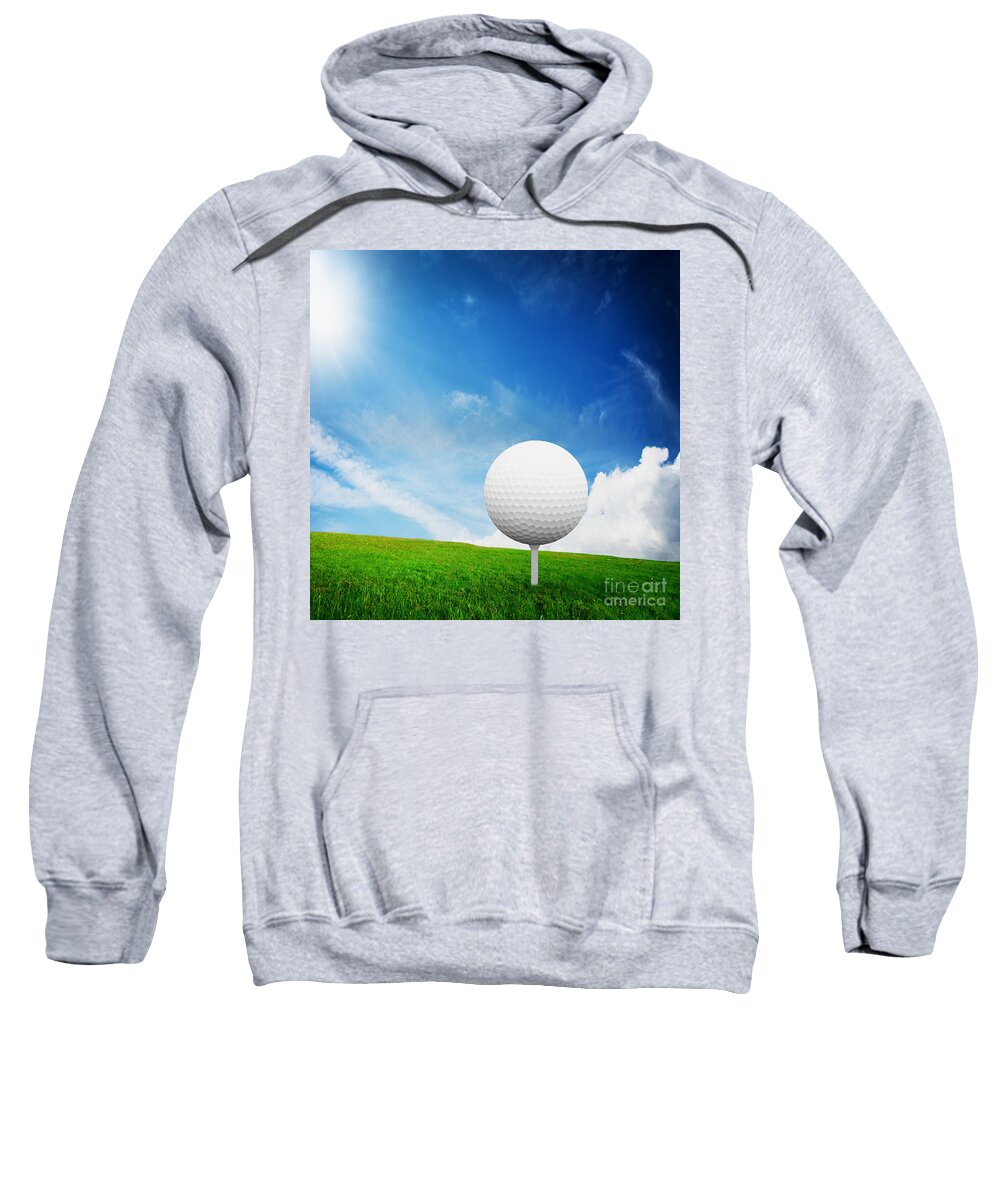 Golf Sweatshirt featuring the photograph Ball on tee on green golf field by Michal Bednarek