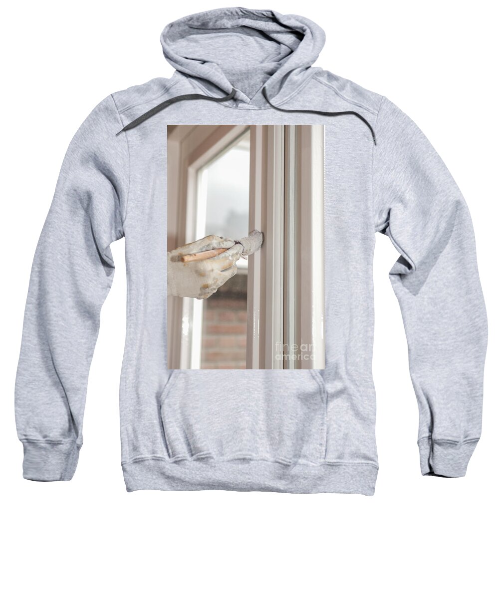 Brush Sweatshirt featuring the photograph Painting a window with white by Patricia Hofmeester