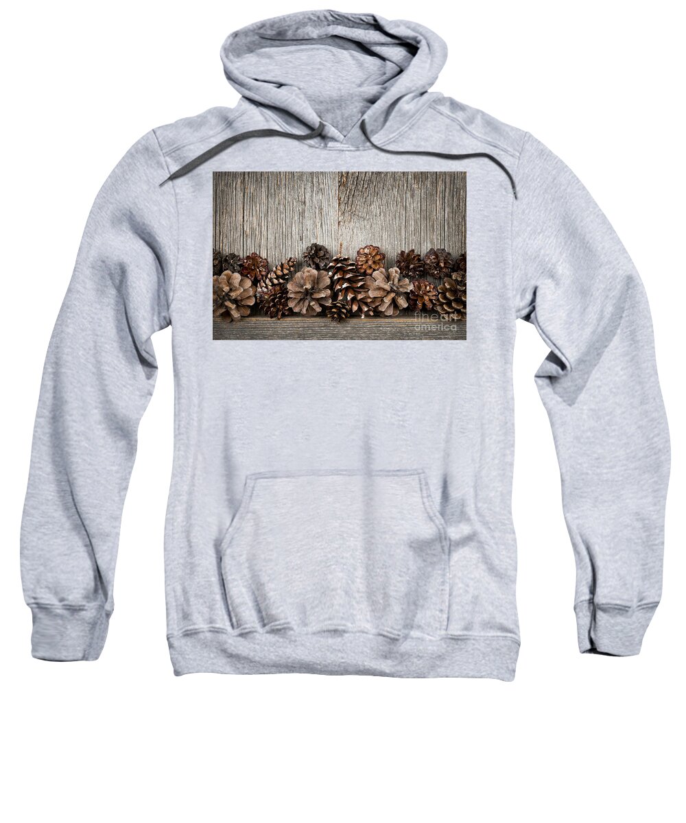 Wood Sweatshirt featuring the photograph Rustic wood with pine cones by Elena Elisseeva