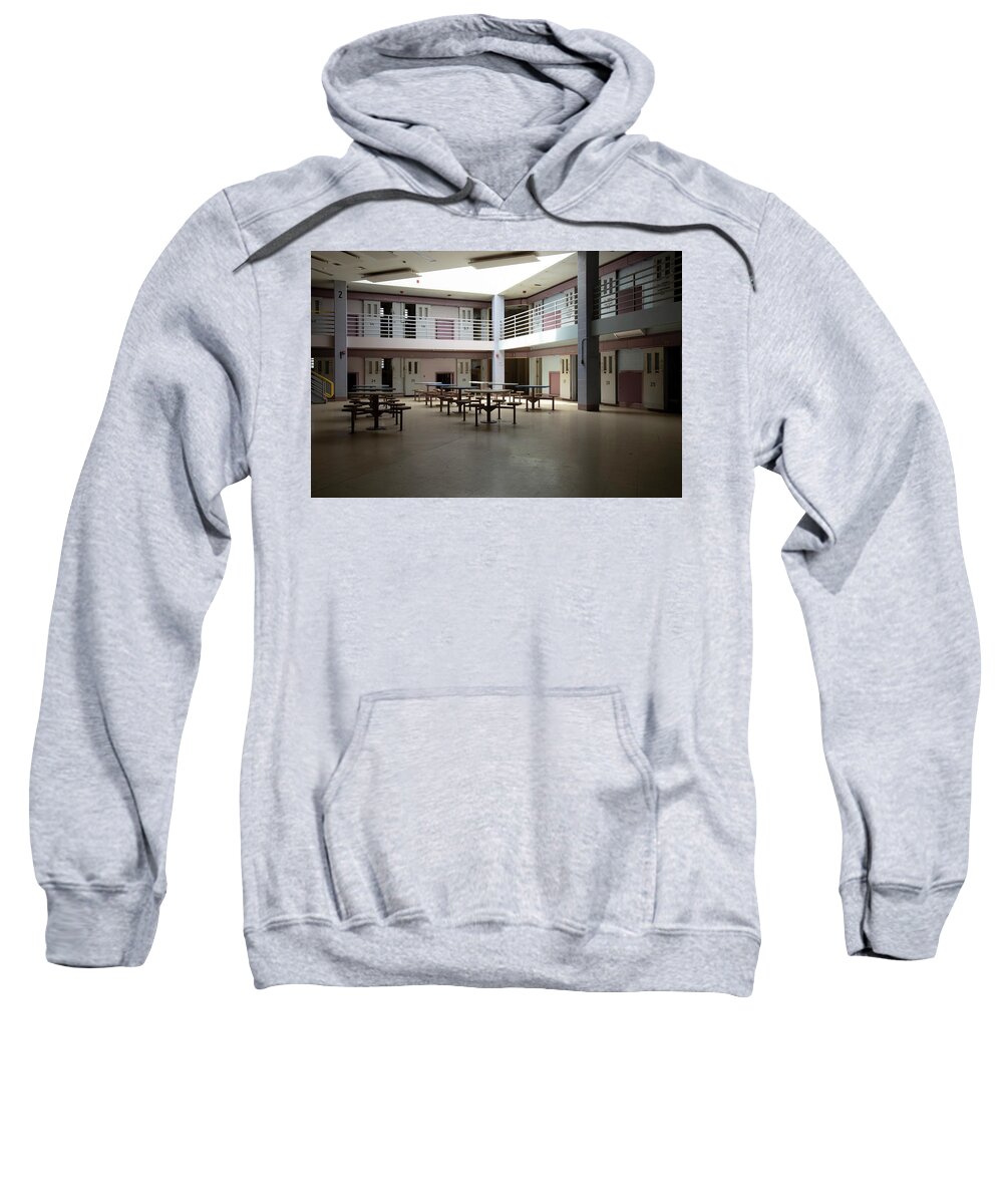 America Sweatshirt featuring the photograph Abandoned jail common room in cell block by Karen Foley