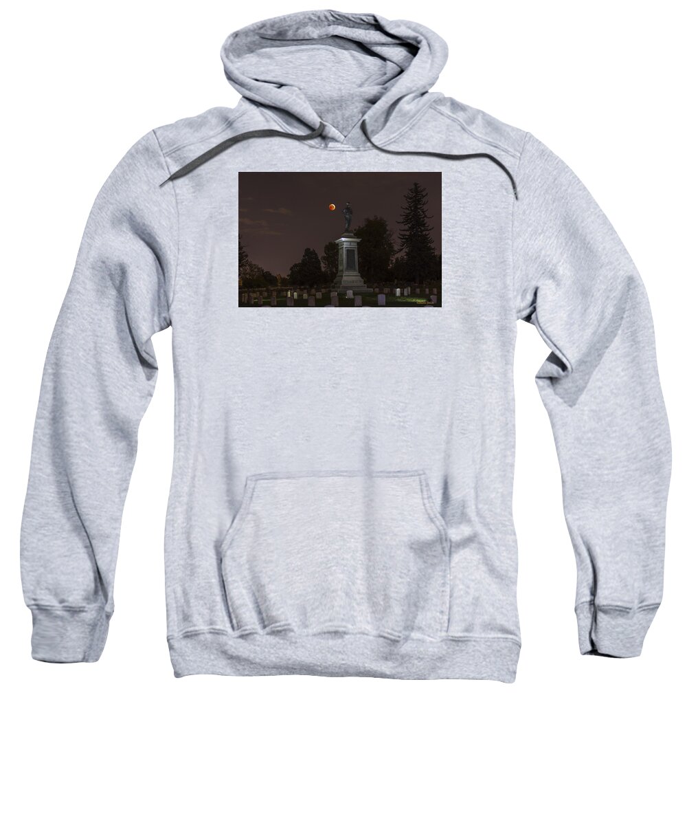 Lunar Eclipse Sweatshirt featuring the photograph Blood Moon at the Colorado Volunteers Memorial by Stephen Johnson