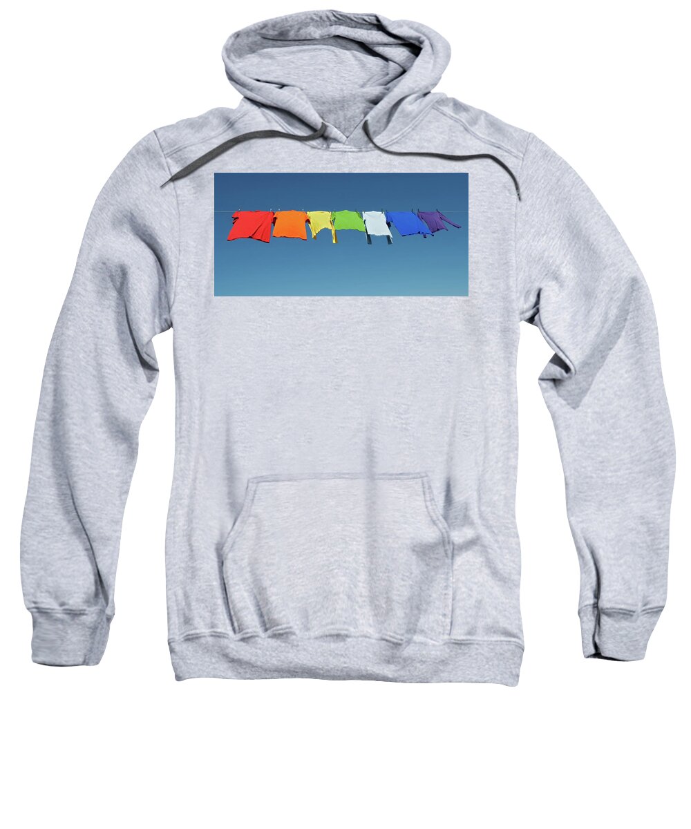 Laundry Sweatshirt featuring the photograph Rainbow laundry, bright shirts on a clothesline by GoodMood Art