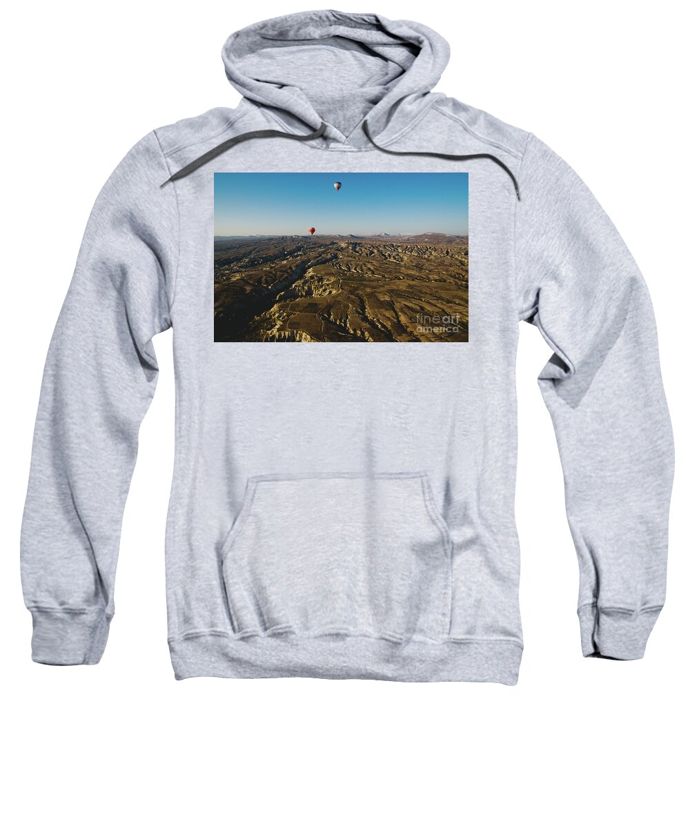 Adventure Sweatshirt featuring the photograph Colorful balloons flying over mountains and with blue sky #6 by Joaquin Corbalan