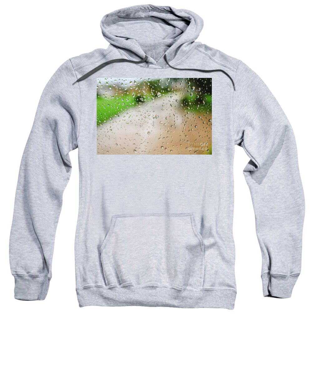 Alone Sweatshirt featuring the photograph Drops of rain on an autumn day on a glass. by Joaquin Corbalan