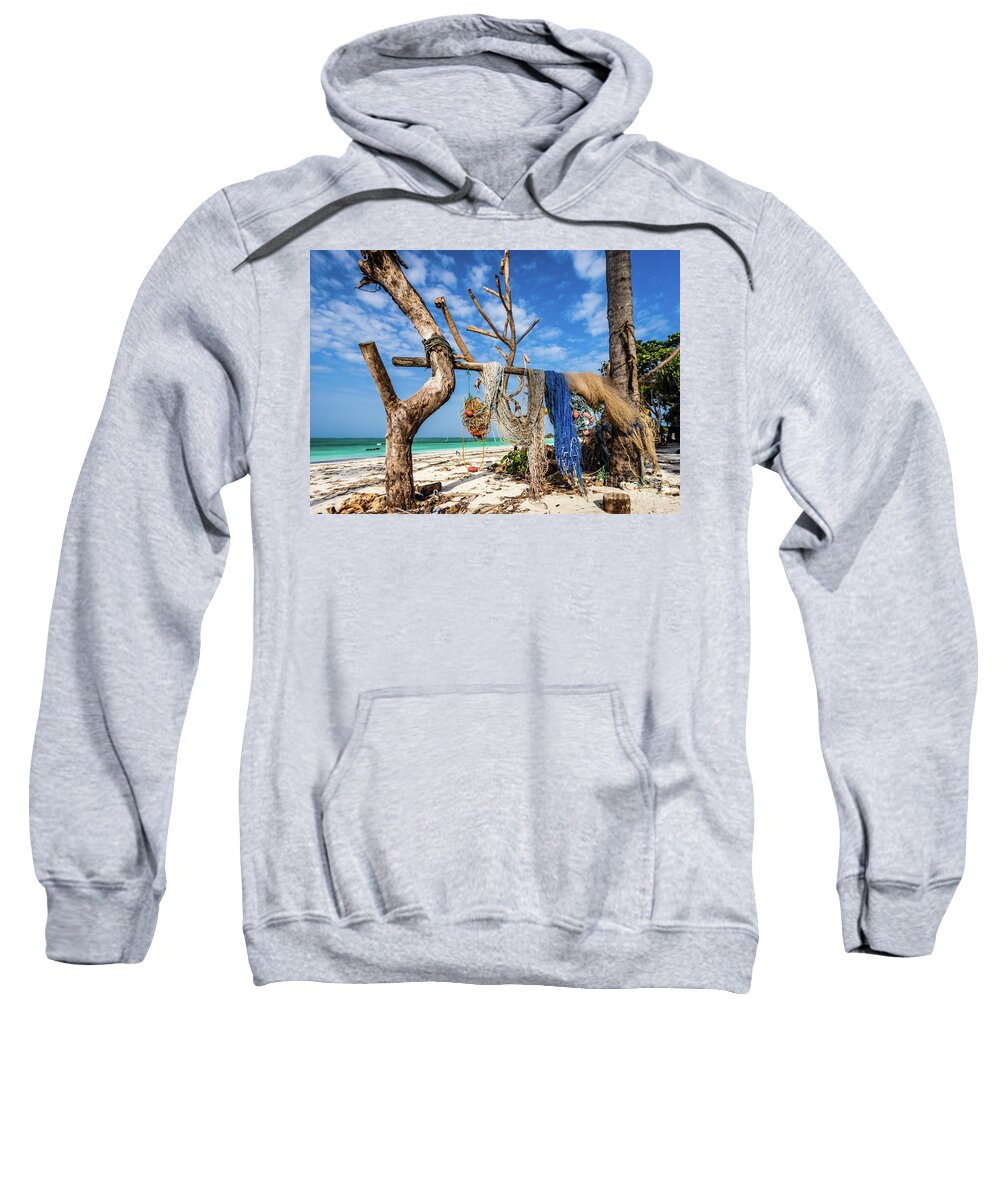 Beach Sweatshirt featuring the photograph Fishing nets drying on the beach by Lyl Dil Creations