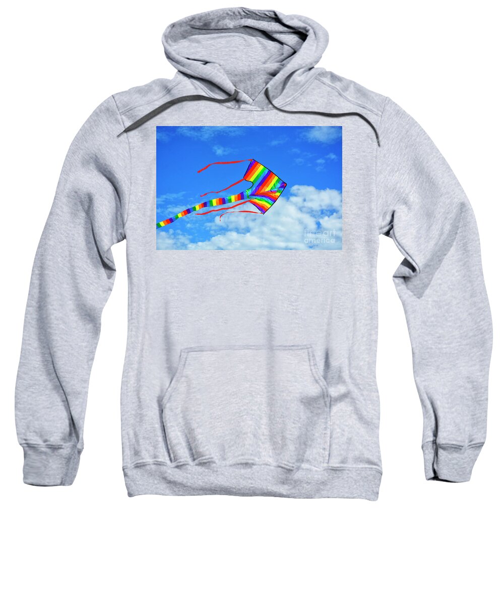 Air Sweatshirt featuring the photograph Rainbow coloured kite against blue skies. #2 by Milleflore Images